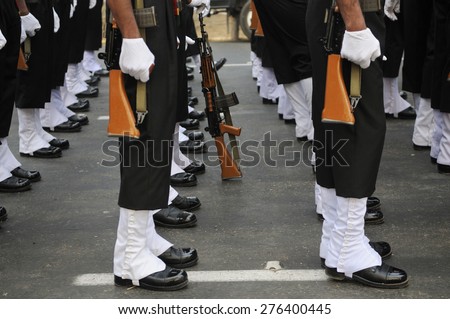 KOLKATA - JANUARY 19 : Indian army soldiers standing in sequence with their weapons in their hand during the Republic Day Parade preparation on January 19, 2015 in Kolkata, India.