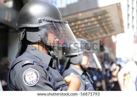 TORONTO-JUNE 25:  Toronto Police officers in riot gear during the G20 Protest on June 25, 2010 in Toronto, Canada.