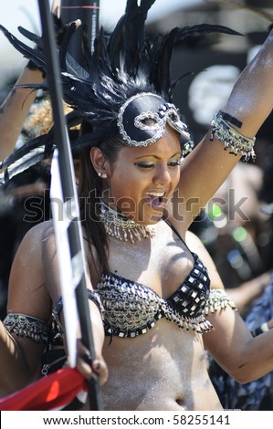TORONTO - JULY 31:  A participant  dancing in the parade during the 43rd Annual Caribana Parade  on July 31, 2010 in Toronto.