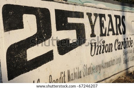 BHOPAL- NOVEMBER 20: Wall writing on the boundary wall of the Union Carbide gas plant to mark the 25th anniversary of the disaster, in Bhopal - India on November 20, 2010.