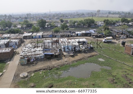 BHOPAL - DECEMBER 4:Water polluted  human settlements on the actual chemical dumping ground of the Union Carbide gas plant  since 1984, in Bhopal - India on December 4, 2010.