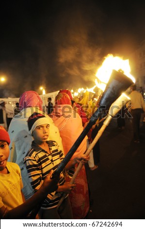 BHOPAL- DECEMBER 2: Children of Bhopal  during the torch rally organized to mark the 26th year of Bhopal gas disaster, in Bhopal - India on December 2, 2010.
