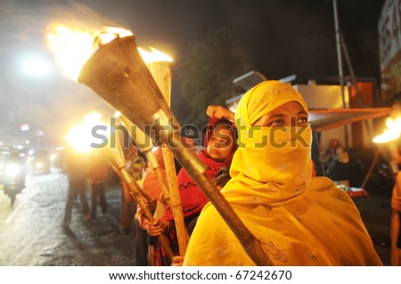 BHOPAL- DECEMBER 2: A Muslim activist during the torch rally organized to mark the 26th year of Bhopal gas disaster,in Bhopal - India on December 2, 2010.