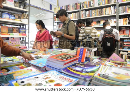 KOLKATA- FEBRUARY 4: People flip through books during the 2011 Kolkata Book Fair in Kolkata, India on February 4, 2011.