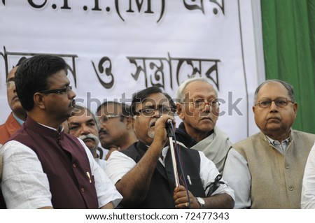 KOLKATA- DECEMBER 20: Partha Chatterjee the leader of opposition in West Bengal legislative assembly  along with his colleagues during a political rally in Kolkata, India on December 20, 2010.