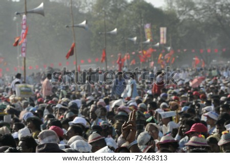 KOLKATA- FEBRUARY 13:   A man showing victory sign to the crowd  during a political rally  in Kolkata, India on February 13, 2011.
