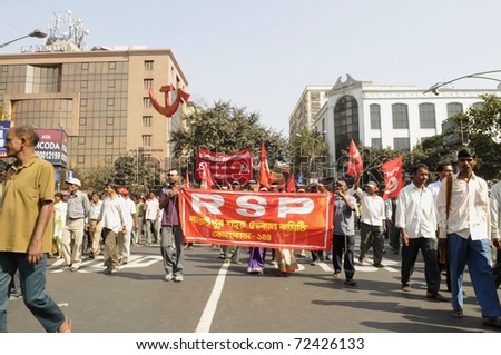 KOLKATA- FEBRUARY 13:  Followers of the Revolutionary Socialist Party a coalition partner in the West Bengal government-participating  in a political rally in Kolkata, India on February 13, 2011.