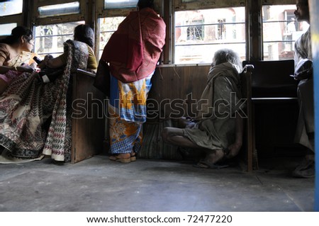 KOLKATA- DECEMBER 20: People stranded on a  streetcar during a political rally in Kolkata, India on December 20, 2010.
