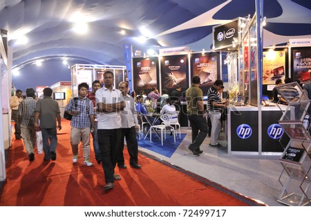 KOLKATA- FEBRUARY 20: People passing by a HP Pavilion during the Information and Communication Technology (ICT) conference and exhibition in Kolkata, India on February 20, 2011.