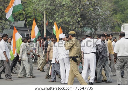 KOLKATA - FEBRUARY 20: Supporters of All India Trinamool Congress walking towards the rally that was  organized to kick the 2011 election champagne, in Kolkata, India on February 20, 2011.