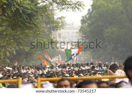 KOLKATA - FEBRUARY 20: Supporters of All India Trinamool Congress waiving their flags during a rally organized to kick the 2011 election campaign, in Kolkata, India on February 20, 2011.