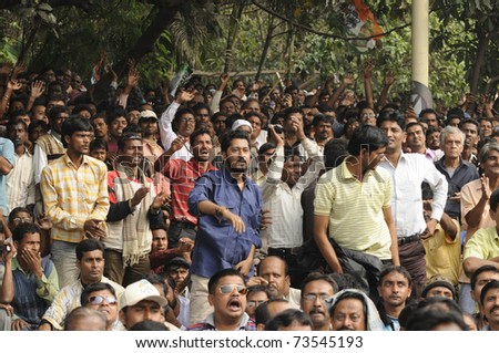 KOLKATA - FEBRUARY 20: Audiences listening  to the speeches during a rally of All India Trinamool Congress ,organized to kick the 2011 election champagne, in Kolkata, India on February 20, 2011.
