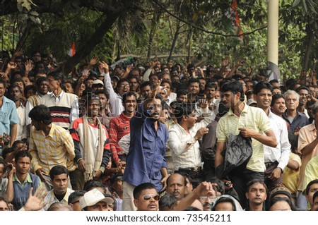 KOLKATA - FEBRUARY 20: Audiences enjoying the speeches during a rally of All India Trinamool Congress ,organized to kick the 2011 election champagne, in Kolkata, India on February 20, 2011.
