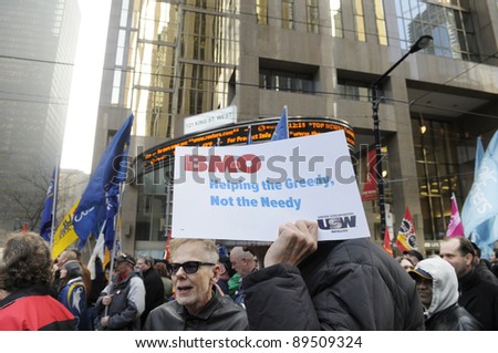 TORONTO - NOVEMBER 24:  Occupy Protesters standing in front of the Toronto Stock Exchange during a rally on November 24, 2011 in Toronto, Canada.