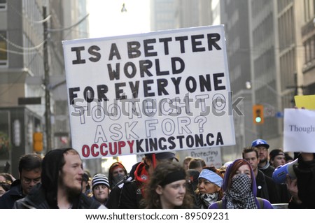 TORONTO - NOVEMBER 24:  Occupy Toronto supporters marching through the downtown streets on November 24, 2011 in Toronto, Canada.