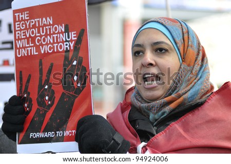 TORONTO - JANUARY 21:   An Egyptian woman participating in a rally at Yonge and Dundas square during the global day of support for the Egyptian revolution on January 21 2012 in Toronto, Canada.