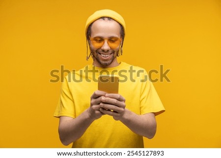 Similar – Image, Stock Photo Young hipster man browsing smartphone