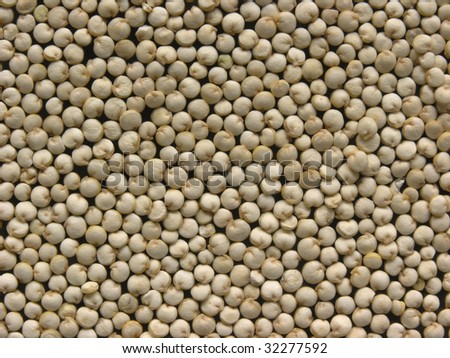 background of healthy organic uncooked white quinoa