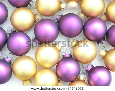 background of gold and purple Christmas tree ornaments