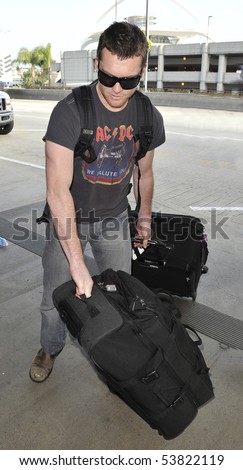 LOS ANGELES - MARCH 24 : Australian actor Sam Worthington star of Avatar and Clash of the Titans is seen at LAX. March 24, 2010 in Los Angeles, California