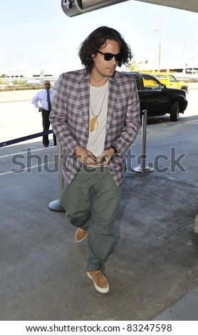 LOS ANGELES-APRIL 17: Singer John Mayer at LAX airport. April 17 in Los Angeles, California 2011