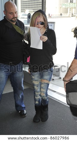 LOS ANGELES-APRIL 06: Singer Avril Lavigne at LAX airport. April 06 in Los Angeles, California 2011
