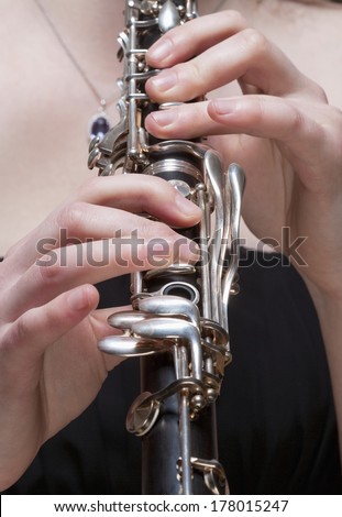 Hands of Young Female Musician Playing Clarinet