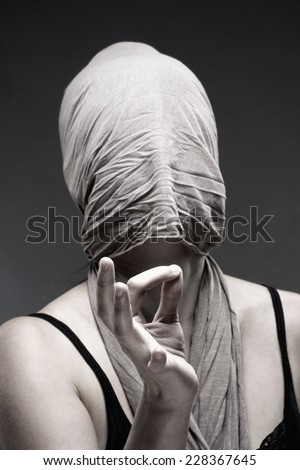 Woman Covering Face with Cloth, Making Hand Sign with Fingers