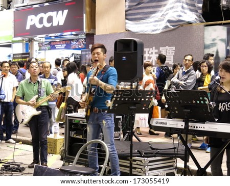 HONG KONG - OCTOBER 27,2013 : Street singers in Mongkok at night on October 27, 2013 in Hong Kong. Singers\' competition for space on the street has created disturbance and noise pollution problems.