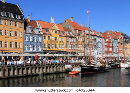 COPENHAGEN - JUNE 5: crowds gather at Nyhavn, the landmark medieval port and bar district, to celebrate the anniversary of Constitution Day on June 5, 2010 in Copenhagen, Denmark.
