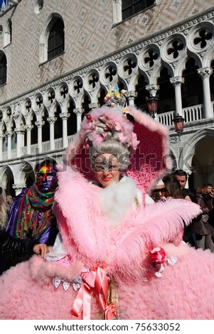 VENICE - FEBRUARY 26: Masked lady greets visitors at the annual Venice Carnival festival on February 26, 2011 in Venice, Italy.