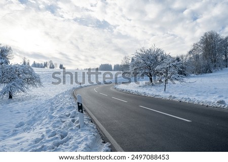 Image, Stock Photo Snowy road in winter forest on blue sky background. Awesome winter landscape. A snow-covered path among the trees in the wild forest. Forest in the snow. Pine and fir in snow after strong snowfall