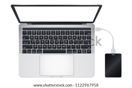 Top view of modern laptop computer Connect with Portable 2.5 inch External Harddrive via USB Cable Isolate on white background.