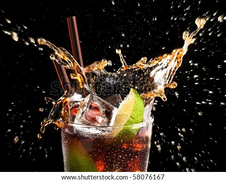 Ice cube and lime splashing cola glass,     Cuba Libre, black backround, close up
