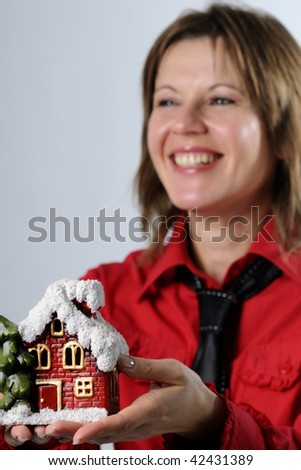 happy woman offering house