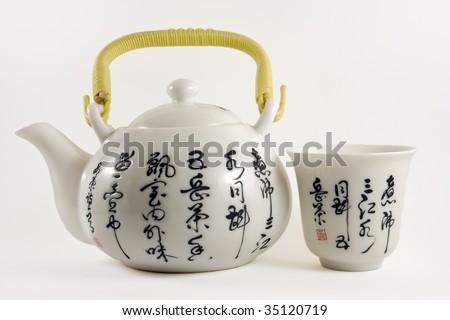 Chinese tea pot with tea cup with chinese writings
