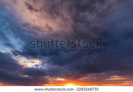 Similar – Image, Stock Photo The last rays of light come through the cloud cover. The vast land is already shrouded in darkness.