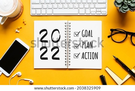 2022 new year goal,plan,action concepts with text on notepad and office accessories.Business management,Inspiration to success ideas