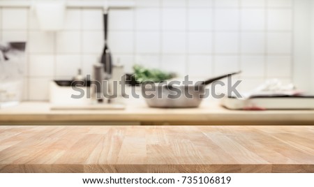 Wood table top on blur kitchen room background .For montage product display or design key visual layout. Stok fotoğraf © 