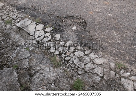 Similar – Foto Bild alte verlassene Asphaltstraße mit verunstalteten Fahrbahnmarkierungen