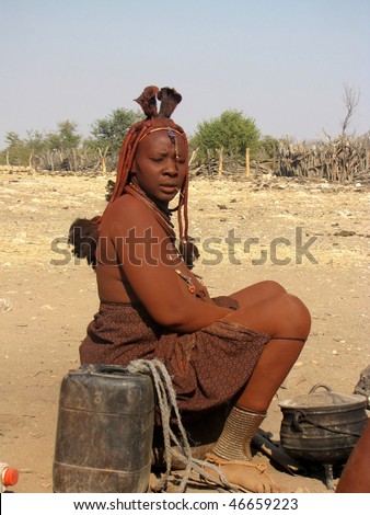 NAMIBIA, KAOKOVELD, AUGUST 29: Himba woman presenting her braids in the village of Himba people near Opuwo in northern Namibia, August 29, 2009, Namibia