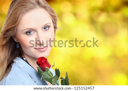 Young girl with rose and yellow background