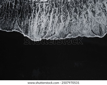 Similar – Image, Stock Photo Wet ocean beach sand with dark wild seaweed. Low tide ocean shore scenery in Ireland.