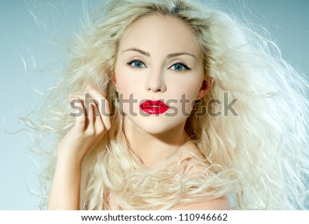 beautiful blonde, heavily made up red lipstick