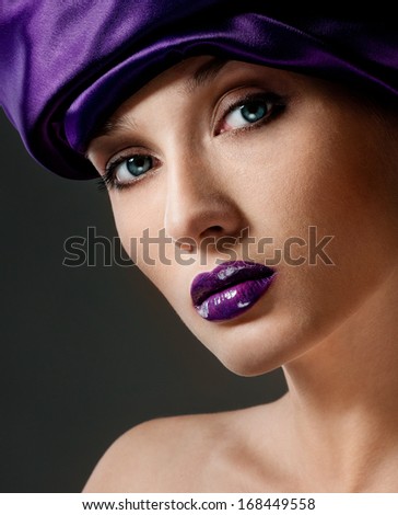Fashion model with purple lipstick, professional makeup