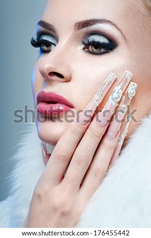 Nail art. Beautiful Woman With perfect  Nails and Luxury Makeup.
