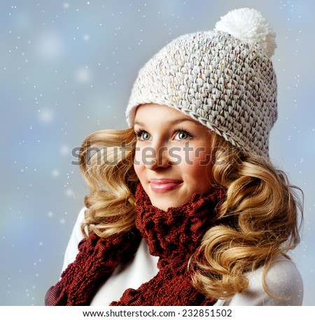 Cheerful woman clothing in warm hat. Winter season.
