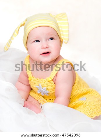 Portrait of the baby in yellow clothes