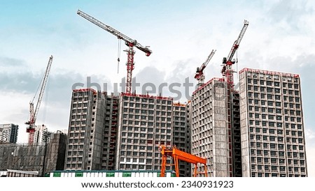 Similar – Image, Stock Photo Skyscraper building construction. Crane working in construction site. Property and real estate development industry. Apartment building construction. Background for REIT fund. Building for rent.