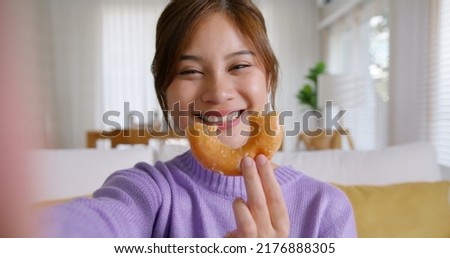 Similar – Image, Stock Photo Smiley girl playing video games at night